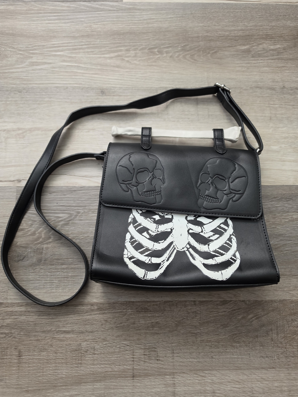 Hot Topic Black Crossbody Bag with White Ribcage & Embossed Skulls